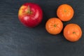 Fruits. Apples, oranges, tangerines on a black background Royalty Free Stock Photo