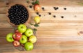 Fruits in an arrangement on a light rustic wooden surface with a black background. Top view Royalty Free Stock Photo