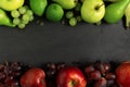 fruits background green and red color set, dark stone slake plate with copy space. Flat lay top view. Summer abstract creative tre