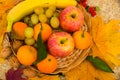 Fruits are in the basket with grapes, apples