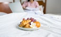 fruits on the bed, young woman used laptop video conferences for business meeting, healthy food and work from home concept Royalty Free Stock Photo