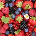 Fruits berries background with strawberries, blueberries and red