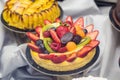 Fruits and berries cakes in shop