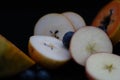 Fruits close up on black stone background Royalty Free Stock Photo