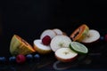 Fruits close up on black stone background Royalty Free Stock Photo