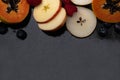 Fruits close up on black stone background Royalty Free Stock Photo