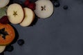 Fruits close up on black stone background Royalty Free Stock Photo