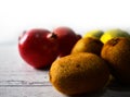 Fruits closeup rustic wooden background kiwi fruit pomegranate orange