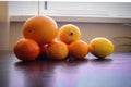 Fruits composition. Orange and lemon on table. Yellow orange brown whhite collors use in photo. Royalty Free Stock Photo