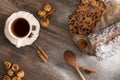 Fruits Cristmas cake on dark brown wooden table. Cinnamon, star anise, figs and cup of tea. Royalty Free Stock Photo