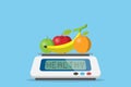 Fruits on digital weight scale with healthy word, diet and health concept