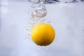 fruits dropped into water and splashing water Royalty Free Stock Photo