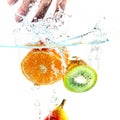 Fruits falling into water Royalty Free Stock Photo