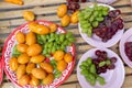 Fruits in green grapes and purple plates look delicious and have Sweet Yellow Marian Plum Royalty Free Stock Photo