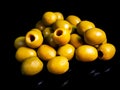 Fruits of green olives berries on a black background Royalty Free Stock Photo