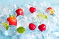 Fruits in ice cubes with cherry and strawberry Royalty Free Stock Photo