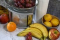 Fruits on a kitchen countertop near a kitchen scale Royalty Free Stock Photo