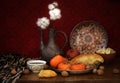 Fruits, nuts, flat cakes, jug and oriental sweets on the table