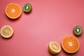 Fruits on the pink background. Orange, lemon, kiwi. Free space for text Royalty Free Stock Photo