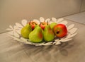 Fruits on the plate as decoration of the kitchen table