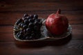 Fruits on a plate, grapes and pomegranate