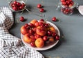 Fruits on the plate. Grey wooden table with napkin Royalty Free Stock Photo