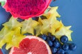 Fruits on a plate- Red dragon fruit, grapefruit, star fruit and blueberries ready to eat Royalty Free Stock Photo