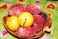 Fruits plums and flat peaches Royalty Free Stock Photo