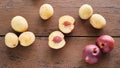 Fruits on a rustic table. Ripe yellow and red peaches are lying on a wooden table Royalty Free Stock Photo