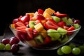 Fruits salad in a glass bowl close-up on a dark background. Healthy food, summer breakfast, low calorie tropical dessert of kiwi, Royalty Free Stock Photo