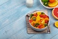 Fruits salad in plate on blue wooden table closeup Royalty Free Stock Photo