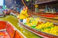 The fruits seller on sampan boat, Damnoen Saduak floating market, Thailand