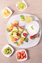 Fruits on sticks and dip Royalty Free Stock Photo
