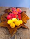 Fruits on a table in a wooden dish, strawberries, apricot, peach, strawberries