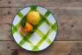 Fruits tangerine and pear in vintage porcelain dish plate Royalty Free Stock Photo