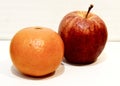 Fruits: tangerines and aplles on a Light background