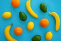 Fruits trendy flat lay. bananas, oranges, avocado and lemons on Royalty Free Stock Photo