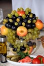 Fruits in a vase on the table, wedding decorWedding bouquets and wedding rings, wedding boutonnieres