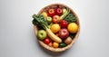 Fruits and vegetables in a basket on a white background, top view Royalty Free Stock Photo