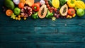 Fruits and vegetables on blue wooden background. Food background. Top view.