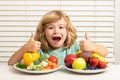Fruits and vegetables. Kid boy eating healthy food vegetables. Breakfast with milk, fruits and vegetables. Child eating Royalty Free Stock Photo