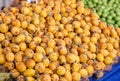 Fruits and vegetables in market closeup. Mature appetizing pears on counter