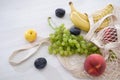 fruits and vegetables in mesh bag on a wooden background copy space top view, eco friendly life style concept, wicker zero waste Royalty Free Stock Photo