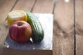 Fruits and vegetables near the old book. Royalty Free Stock Photo