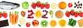 Fruits and vegetables. New year 2021 made of delicious food on the white background. Healthy food.