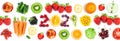 Fruits and vegetables. New year 2021 made of fruits and vegetables on the white background. Healthy food