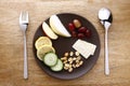 Fruits, vegetables, nuts and crackers on a plate Royalty Free Stock Photo