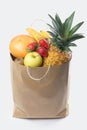 Fruits and vegetables in paper grocery bag isolated over white Royalty Free Stock Photo