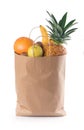 Fruits and vegetables in paper grocery bag isolated over white Royalty Free Stock Photo