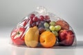 Fruits and vegetables in a plastic bags on white background